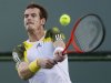 And Murray of Britain returns a shot against Berlocq of Argentina during their match at the BNP Paribas Open ATP tennis tournament in Indian Wells, California