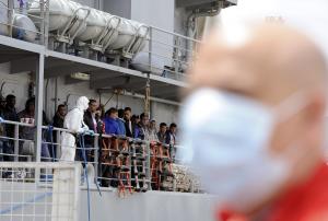 Migrants wait to disembark from the Irish navy ship &hellip;