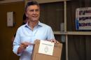 Presidential candidate for "Cambiemos" party Mauricio Macri prepares to cast his vote in Buenos Aires, on November 22, 2015