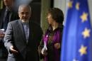 European Union foreign policy chief Ashton and Iranian Foreign Minister Mohammad Zarif arrive at a news conference at the end of the Iranian nuclear talks in Geneva