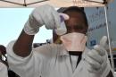 A medical worker at a mobile testing facility for tuberculosis at Driefontein Gold Mine in Carletonville on March 24, 2012