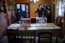 Election workers stand inside a house after preparing it as a polling station ahead of Spain's general election in Puerto Sauco