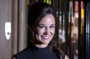 Pippa Middleton, sister of Catherine, Duchess of Cambridge, poses for photographers to promote her first book "Celebrate", on party planning, in London