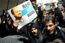 A protestor holds up a poster with a picture of Turkish Prime Minister's son Bilal Erdogan reading "Bilal, pay for our ticket as well" during a demonstration against corruption on December 31, 2013 at Taksim Underground station in Istanbul