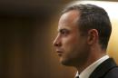 FILE - In this Tuesday, May 20, file photo, Oscar Pistorius listens as a court ruling is handed down that he would undergo psychiatric evaluation in Pretoria, South Africa. The murder trial of Pistorius resumes Monday, June 30, 2014 after one month during which mental health experts evaluated the athlete to determine if he has an anxiety disorder that could have influenced his actions on the night he killed girlfriend Reeva Steenkamp. (AP Photo/Siphiwe Sibeko, Pool, File)