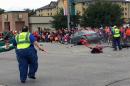 This Oct. 24, 2015 FILE image taken from video shows the scene in Stillwater, Okla. as a car crashes into spectators at Oklahoma State University's homecoming parade. On Wednesday, Nov. 4, 2015,Payne County District Attorney Laura Thomas formally charged Adacia Chambers with four counts of second-degree murder and 46 counts of felony assault. (Connor J. Greco via AP, File)