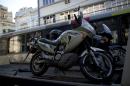 Two motorcycles that belonged to Italian tourists that were touring South America are picked up and taken away by authorities in Rio de Janeiro, Brazil, Thursday, Dec.8, 2016. Police say Italian tourist Roberto Bardella was killed by alleged drug traffickers as he drove his bike by one of the entrance of the Morro dos Prazeres favela. Rio de Janeiro police said another Italian tourist named Rino Polato was found early in the day unharmed at an entrance to the Morro dos Prazeres favela. (AP Photo/Silvia Izquierdo)