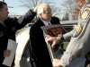 In this photo provided by the Pennsylvania Office of Attorney General, former Penn State football defensive coordinator Gerald "Jerry" Sandusky, center, is placed in a police car iin Bellefonte, Pa. to be taken to the office of a Centre County Magisterial District judge on Saturday, Nov. 5, 2011. Sandusky is charged with sexually abusing eight young men. Also, Penn State athletic director Tim Curley and Penn State vice president for finance and business Gary Schultz, 62, are expected to turn themselves in on Monday on charges of perjury and failure to report under Pennsylvania’s child protective services law in connection with the investigation into the abuse allegations against Sandusky. (AP Photo/Pennsylvania Office of Attorney General, Commonwealth Media Services)