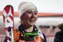 US skier Mikaela Shiffrin smiles after winning gold in the Women's Alpine Skiing Slalom at the Rosa Khutor Alpine Center during the Sochi Winter Olympics on February 21, 2014