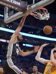 San Antonio Spurs forward Tim Duncan, left, dunks over Los Angeles Lakers forward Pau Gasol (16), of Spain, during the first half in Game 3 of a first-round NBA basketball playoff series on Friday, April 26, 2013, in Los Angeles. (AP Photo/Mark J. Terrill)