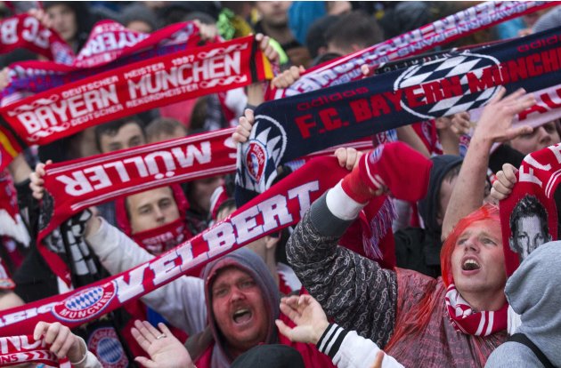 Bayern Munich and Borussia Dortmund supporters attend a public screening of the Champions League Final soccer match in Berlin