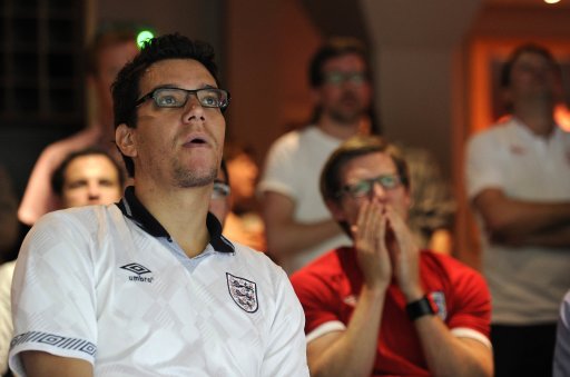 England fans react watching England's Euro 2012 soccer match against Ukraine Euro 2012 at pub in London