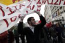 Protesters chant slogans during a rally in Athens on Saturday, Nov. 17, 2012. Several thousand marchers are commemorating the 39th anniversary of a deadly student uprising against the then ruling dictatorship, with more than 6,000 police deployed in the center of the Greek capital.(AP Photo/Petros Giannakouris)