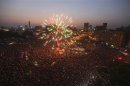 Fireworks explode as supporters of Muslim Brotherhood's presidential candidate Mohamed Morsy celebrate his victory in the election at Tahrir Square in Cairo
