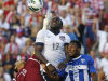United States' Jozy Altidore (17) heads the ball as Honduras' goalie Noel Valladares (18) and teammate Jose Velasquez (5) defend in the second half during a World Cup qualifying soccer match at Rio Tinto Stadium on Tuesday, June 18, 2013, in Sandy, Utah. The United States defeated Honduras 1-0.  (AP Photo/Rick Bowmer)