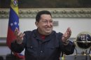 Venezuelan President Hugo Chavez smiles as he speaks during a Council of Ministers at Miraflores Palace in Caracas