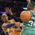 Los Angeles Lakers guard Kobe Bryant, left, passes around Boston Celtics forward Paul Pierce during the first half of their NBA basketball game, Wednesday, Feb. 20, 2013, in Los Angeles. (AP Photo/Mark J. Terrill)