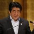 Japan's PM Abe delivers a speech at a seminar in Tokyo