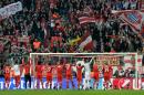 Bayern's players celebrate with supporters after the Champions League quarterfinal second leg soccer match between Bayern Munich and Manchester United in the Allianz Arena in Munich, Germany, Wednesday, April 9, 2014. Munich defeated Manchester by 3-1. (AP Photo/Kerstin Joensson)