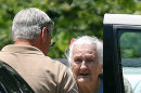James Duncan talks to his 97-year-old mother while moving her out of Alzheimer's Care of Commerce Tuesday, July 2, 2013 after officials executed an early morning search warrant on the facility. The GBI announced that 21 people at the facility were being charged with abusing residents there. Duncan said that he was shocked by the charges and had never suspected any problems. (AP Photo/The Atlanta Journal-Constitution, Ben Gray)