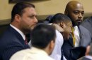 AP10ThingsToSee - Defense attorney Walter Madison, right, holds his client, 16-year-old Ma'Lik Richmond, second from right, while defense attorney Adam Nemann, left, sits with his client Trent Mays, foreground, 17, as Judge Thomas Lipps pronounces them both delinquent on rape and other charges after their trial in juvenile court in Steubenville, Ohio, Sunday, March 17, 2013. Mays and Richmond were accused of raping a 16-year-old West Virginia girl in August 2012. (AP Photo/Keith Srakocic, File)