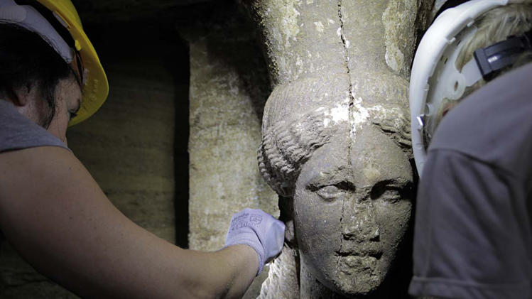 This picture released by the Greek Ministry of Culture on September 7, 2014 shows one of the two statues of a Caryatid inside the Kasta Tumulus in ancient Amphipolis, northern Greece