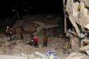 Firefighters do rescue work in Pedernales, after an earthquake struck off Ecuador's Pacific coast
