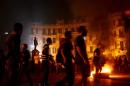Egyptian protesters set fire to a barricade after clashes with security forces at Talaat Harb Square in Cairo, on November 26, 2013