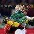Denmark's Simon Kjaer fights for the ball with Cameroon's Samuel Eto'o during a 2010 World Cup Group E soccer match in Pretoria