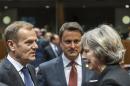 European Council President Donald Tusk, left, speaks with British Prime Minister Theresa May, right, during a round table meeting at an EU Summit in Brussels on Thursday, Dec. 15, 2016. European Union leaders meet Thursday in Brussels to discuss defense, migration, the conflict in Syria and Britain's plans to leave the bloc. At center is Luxembourg's Prime Minister Xavier Bettel. (AP Photo/Geert Vanden Wijngaert)