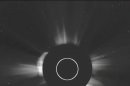 UFO Spaceship Orbiting the Sun, or a Camera Glitch?