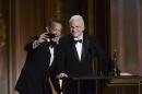 Actor Tom Hanks, left, takes a photo with actor and honoree Steve Martin at the 2013 Governors Awards on Saturday, Nov. 16, 2013 in Los Angeles. (Photo by Dan Steinberg/Invision/AP)