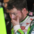 NASCAR driver Dale Earnhardt Jr., watches as crew members work on his car in the garage at Talladega Superspeedway in Talladega, Ala., Friday, Oct. 5, 2012. The drivers are preparing for Sunday's running of the NASCAR Sprint Cup Series auto race. (AP Photo/Rainier Ehrhardt)
