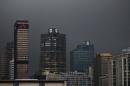 The logos of South Africa's three biggest banks, ABSA, Standard Bank and First National Bank, adorn buildings as winter storms hit Cape Town