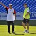Liverpool's Rodgers gestures beside Cole during his team's practice session in Toronto