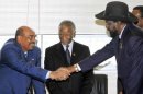 Sudan's President al-Bashir shakes hands with South Sudan's President Kiir in Addis Ababa
