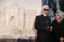 German designer Karl Lagerfeld and Creative Director of Fendi, Silvia Fendi arrive to attend a news conference to present a project of cultural patronage that will involve Rome's Trevi fountain and others monuments, in Rome
