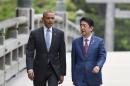US President Barack Obama (L) with Japan's Prime Minister Shinzo Abe (R) as they arrive at Ise-Jingu Shrine on May 26, 2016, on the first day of the G7 leaders summit