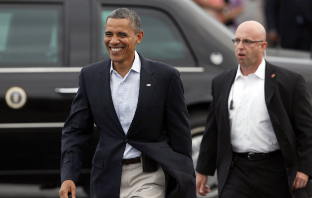 President Barack Obama walks over to greet supporters after arriving at Toledo Express Airport in Swanton, Ohio, Sunday, Sept. 2, 2012. (AP Photo/Madalyn Ruggiero)