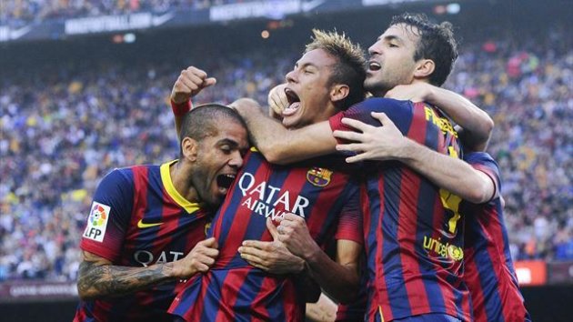 Dani Alves and Cesc Fabregas congratulate Neymar on his goal for Barcelona against Real Madrid (Getty)