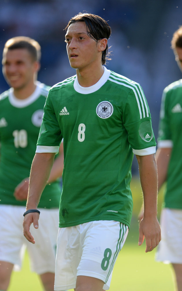 Germany's midfielder Mesut Ozil reacts d