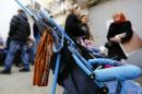 A ribbon of St. George is seen on a pram as people queue to apply for Russian passports at a passport office in the Crimean port of Sevastopol