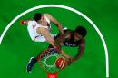 USA's DeAndre Jordan jumping for the basket as China's Wang Zhelin attempts a block during the match at the Carioca Arena 1 in Rio de Janeiro on August 6, 2016