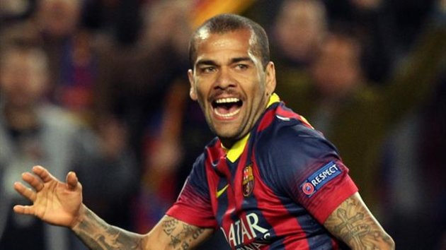 Barcelona's Dani Alves celebrates after scoring a goal against Manchester City during their Champions League last 16 second leg soccer match at Camp Nou stadium in Barcelona March 12, 2014 (Reuters)