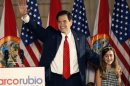 File photo of U.S. Republican Senate candidate Marco Rubio waving beside his daughter during his victory speech at a rally in Florida