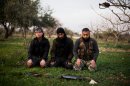 FSA fighters pray after an attack on a Military Academy in Tal Sheer village, north of Aleppo province, Syria, Thursday, Dec 13, 2012. (AP Photo / Manu Brabo)