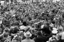 President John F. Kennedy is shown reaching out to the crowd in Fort Worth, Texas, hours before he died on November 22, 1963