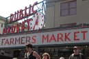 People walk in front of the iconic sign for Seattle's Pike Place Market, Friday, Aug. 31, 2012, as they enjoy a sunny day. Not too many people are complaining in typically-soggy Seattle, but the city is on a surprising run of dry weather. No rain has fallen this month at Sea-Tac Airport and the National Weather Service forecasts none on Friday, setting a record for the driest August. (AP Photo/Chris Grygiel)