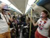 Andy King and Molly Wilson from the U.S. travel to the Olympic Park on the Tube in London