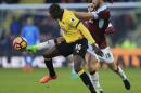 Burnley's George Boyd, right, and Watford's Abdoulaye Doucoure battle for the ball during the English Premier League soccer match at Vicarage Road, Watford, England, Saturday Feb. 4, 2017. (Nigel French/PA via AP)